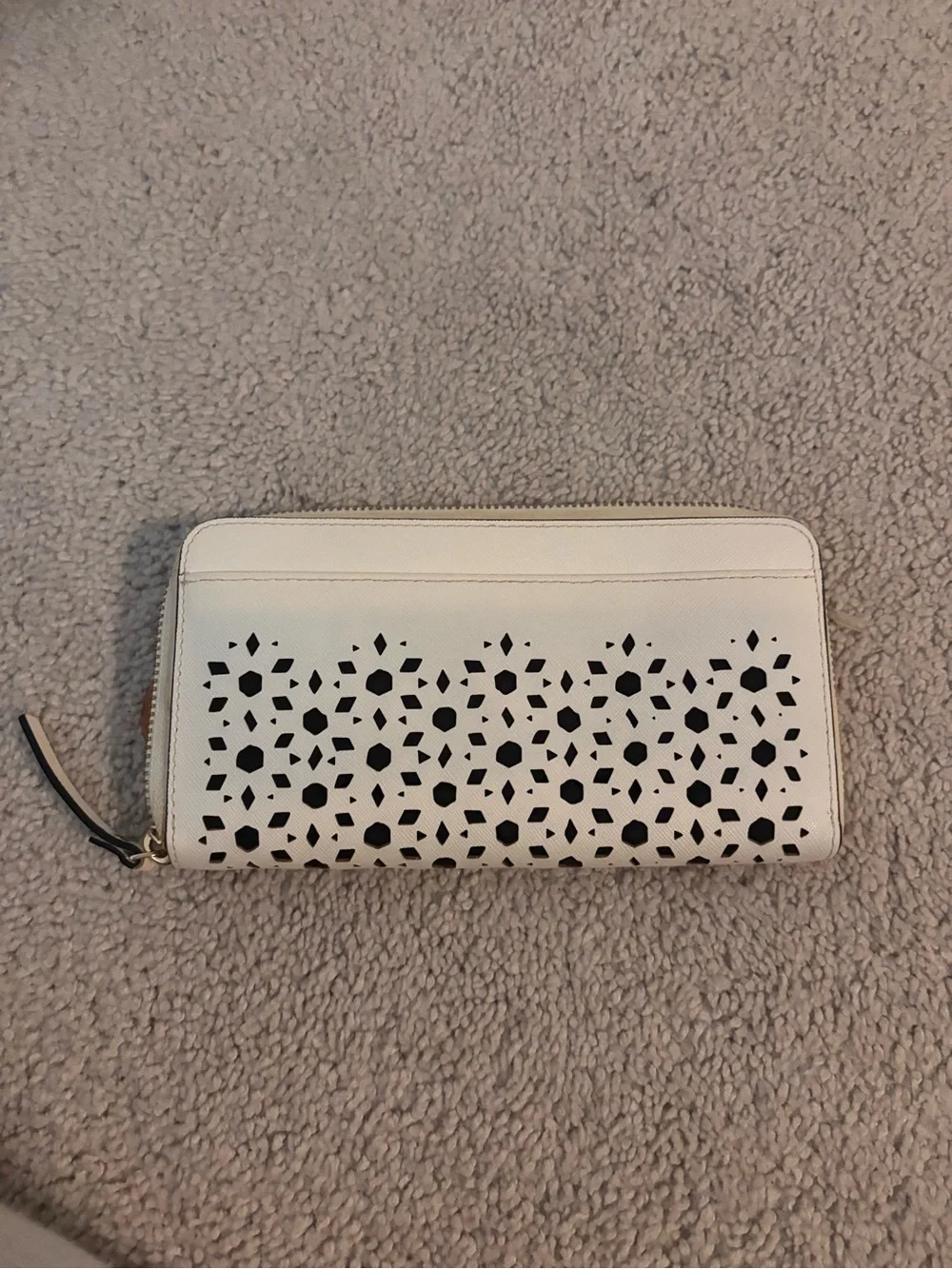 kate spade cream laser-cut floral zip-around wallet with black underlay